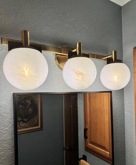 Monteaux Lighting 736916727501 Brooklyn 24 Inch 3-light Gold Bathroom Vanity Light White Swirl Glass Shade