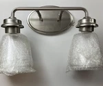Millennium Vanity Lights 2462BN 2-LIGHT Brushed Nickel Seeded Glass New Open Box. Fixed Price $76.98.