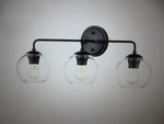 Millennium Lighting 25.5 In. 3-LIGHT Matte Black Vanity. Fixed Price $42.25.
