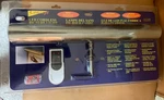 Concept 302L Cordless Remote Controlled Picture Light 18" Antique Brass New. Fixed Price $80.00.