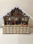 Led 24 Day Advent Calendar Decorated With Christmas Tree House Figurines Lights. Fixed Price $59.00.
