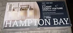 Hampton Bay Cade 3-LIGHT Brushed Nickel Finish Frosted White Vanity. Fixed Price $45.00.