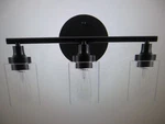 Merra 17 In. 3-LIGHT Modern Matte Black Vanity-light With Clear Glass Shade. Fixed Price $31.96.