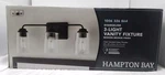 Hampton Bay Evangeline 23 In. 3-LIGHT Modern Bronze Farmhouse Bathroom Vanity. Fixed Price $32.54.