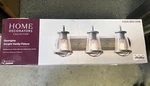 Home Decorators Georgina 24 In. 3-LIGHT Weathered Iron Industrial Indoor Vanity. Fixed Price $45.00.