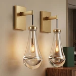 2 Pack Indoor Wall Light Raindrop Elegant Gold Sconce Clear Glass Fixture. Fixed Price $149.99.