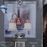Hampton Bay Designer Edition Vanity Light With Tuscan Patina Finish. Fixed Price $33.00.
