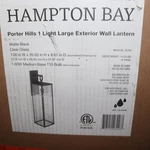 Hampton Bay Hardwired Wall Mount Lantern Sconce Matte Black 26". Fixed Price $54.99.
