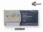 Hampton Bay Pavlen 24 In. 3-LIGHTS Antique Brass Vanity Clear Glass Shades. Fixed Price $49.90.
