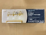 Hampton Bay Hensley 21 3-LIGHT Gold And Faux Marble Bathroom Vanity C6378. Fixed Price $38.00.
