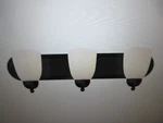 Bel Air Lighting Reed 24 3-LIGHT Black Bathroom Vanity With Glass Shade. Fixed Price $40.45.