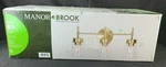Manor Brook Bea 3-LIGHT Antique Brass Vanity With Clear Glass. Fixed Price $79.63.