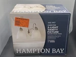 New Hampton Bay Hamilton 2-LIGHT Brushed Nickel Vanity With Frosted Glass. Fixed Price $18.14.