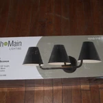 Fifth And Main Lighting Whitney 3-LIGHT Vanity With Black Metal Shade 7.5". Fixed Price $29.98.