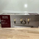 Evelyn 3-LIGHT Brushed Nickel Vanity. Fixed Price $34.19.