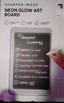 Sharper Image Neon Glow Art Board, Wipe-clean Screen, 5 Light Modes, 6 Markers. Fixed Price $30.00.
