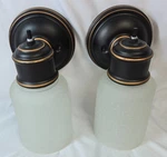 Portfolio Wall Sconce Oil-rubbed Bronze Vanity Light Fixture Frosted Shades 5". Fixed Price $16.22.