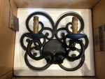 Metropolitan Castile Two Light Wall Sconce Black Wrought Iron Scroll Work. Fixed Price $150.00.