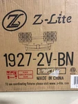 Z-lite 1927-2V-BN Rubicon Vanity Light, 14" Wide, Textured Glass, Brushed Nickel. Fixed Price $93.99.