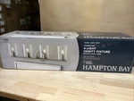 Hampton Bay Champlain 31.5" 4-LIGHT Brushed Nickel Bathroom Vanity W/glass. Fixed Price $18.00.