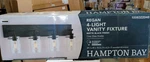 Hampton Bay Regan 29.25 In. 4-LIGHT Matte Black Bathroom Vanity New. Fixed Price $105.00.