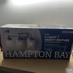 Hampton Bay Cade 3-LIGHT Brushed Nickel Vanity New. Fixed Price $54.59.