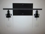 Merra 14 In. 2-LIGHT Matte Black Modern Vanity-light With Clear Glass Shade. Fixed Price $29.71.