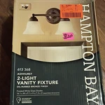 Hampton Bay Ashhurst 2-LIGHT Vanity Fixture Oil-rubbed Bronze Frosted Glass. Fixed Price $17.99.