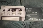 Hampton Bay Southbourne 28" 4-LIGHT Matte Black Vanity W/ Steel Cage Frame. Fixed Price $35.00.