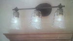 Nib Nice 3-LITE Bronze-finish Bathroom Vanity Light W/ Clear Glass Shades. Fixed Price $79.95.