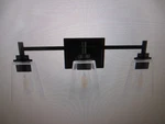 Hampton Bay Wakefield 22 In. 3-LIGHT Matte Black Modern Vanity With Clear Shades. Fixed Price $33.26.