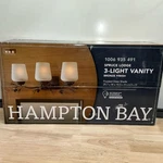 Hampton Bay Spruce Lodge 25 In. 3-LIGHT Handmade Pinecone Vanity. Fixed Price $67.49.