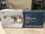 Hampton Bay Truitt 3-LIGHT Brushed Nickel Bath Bar W Clear Sand Glass. Fixed Price $14.99.