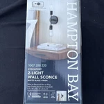 Hampton Bay Stockport 2-LIGHT Matte Black Wall Sconce. Fixed Price $8.00.