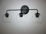 Millennium Lighting 25.5 In. 3-LIGHT Matte Black Vanity. Fixed Price $42.25.