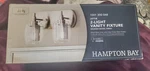 New Hampton Bay Lettie 2-LIGHT Brushed Nickel Vanity. Fixed Price $45.00.