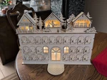 Kurt Adler Battery Operated Lighted Advent Calendar House With Market 17". Fixed Price $40.00.