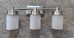 Hampton Bay Cade 3-LIGHT Brushed Nickel Vanity. Fixed Price $25.95.