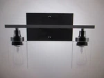 Merra 14 In. 2-LIGHT Matte Black Modern Vanity-light With Clear Glass Shade. Fixed Price $29.71.