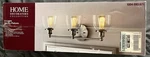 Home Decorators Collection Evelyn 3 Light Brushed Nickel Vanity Clear. Fixed Price $26.24.