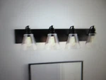 Hampton Bay Manor 33 In. 4-LIGHT Matte Black Industrial Bathroom Vanity. Fixed Price $66.45.