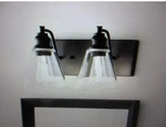 Hampton Bay Manor 15.3 In. 2-LIGHT Matte Black Industrial Bathroom Vanity. Fixed Price $21.24.