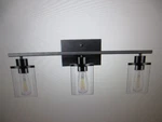 Edishine 24 In. 3-LIGHT Matte Black Vanity With Clear Glass Shade. Fixed Price $44.95.