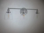Home Decorators Evelyn 26.75 In. 3-LIGHT Brushed Nickel Industrial Vanity. Fixed Price $35.10.